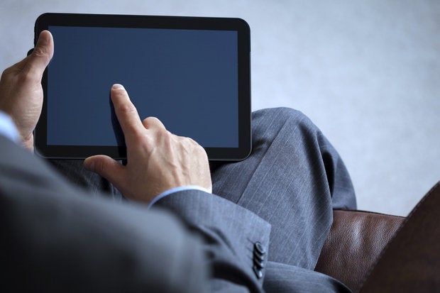 business man working on digital tablet 153986794
