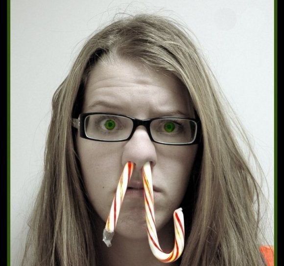 woman with candy cane in her nose