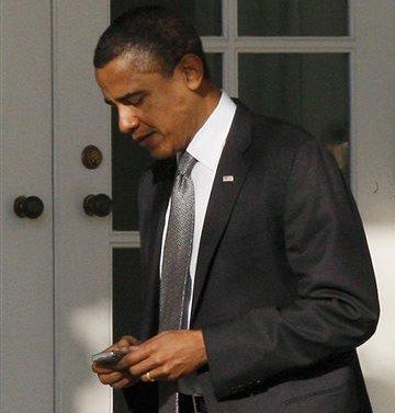 image of President Obama with BlackBerry 8830
