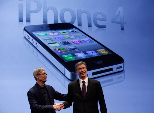 Apple Chief Operating Officer Tim Cook shakes hands with Verizon Wireless president and CEO Dan Mead