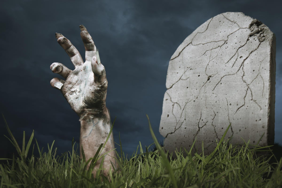 Zombie hand coming out of the ground 154213305