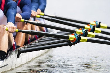 close up of mens rowing team sports cooperation