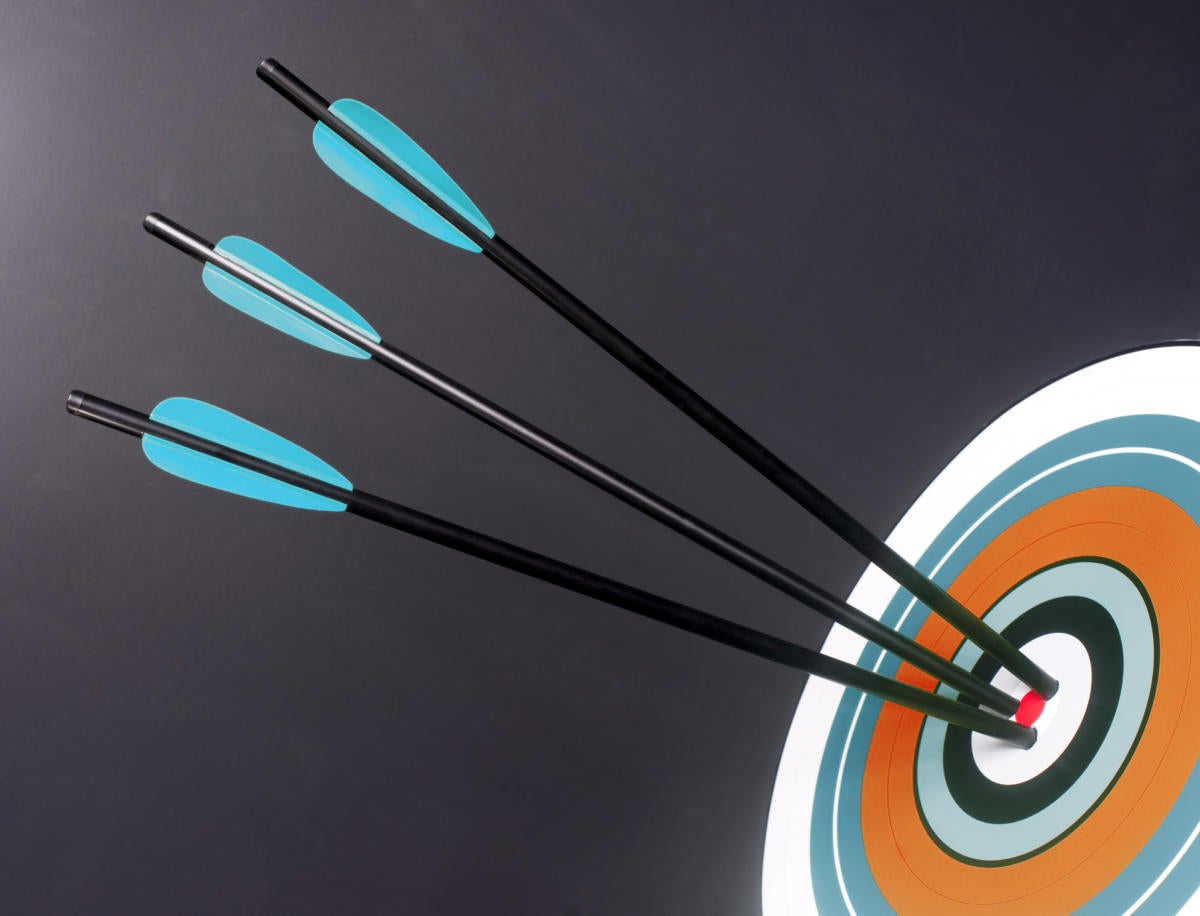 three blue black archery arrows hit round target bullseye center 167437636