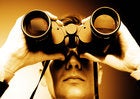 Man looking through binoculars preview look watching