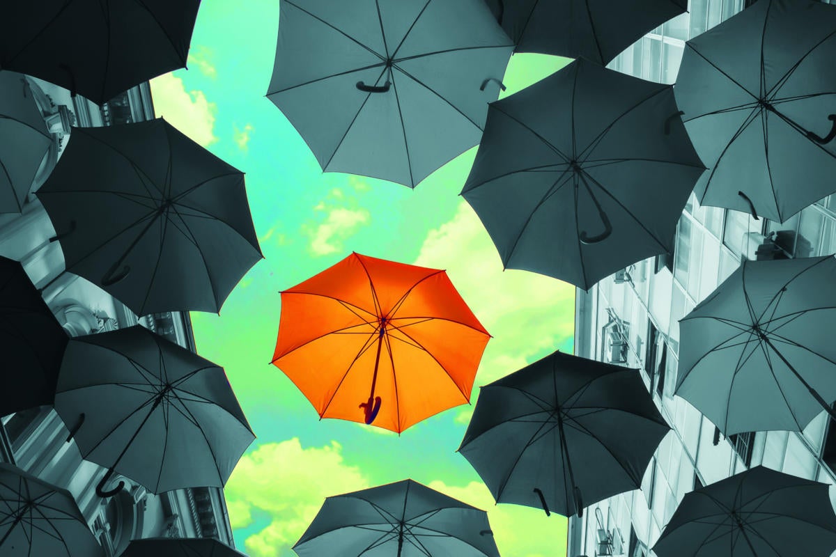floating umbrellas against a blue cloudy sky