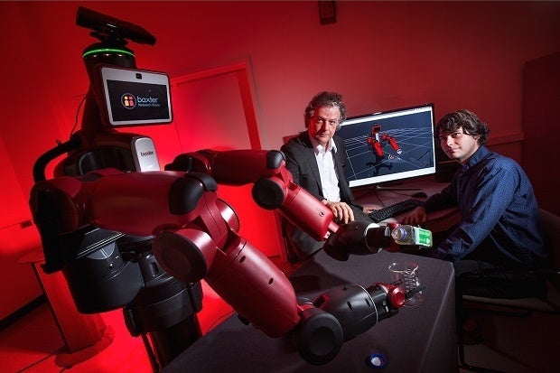 Yiannis Aloimonos (center) led a team that programmed robots to learn by watching YouTube.
