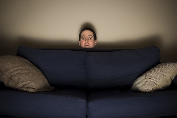 tv_man_hiding_behind_couch_stock-100567376-large.jpg