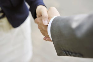 handshake businesswoman businessman stock
