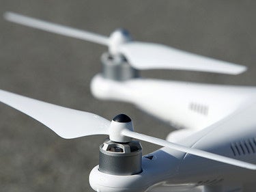 Secom security drone follows, photographs intruders