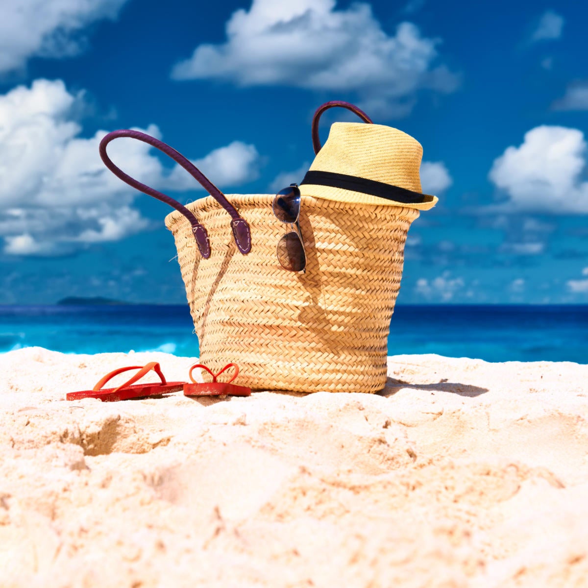 beach bag with hat and flip flops
