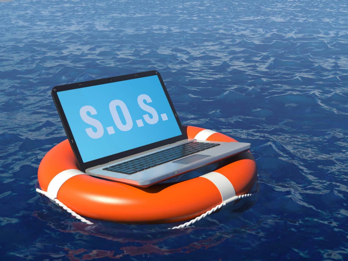 Laptop floating on life preserver in ocean needing to be rescued