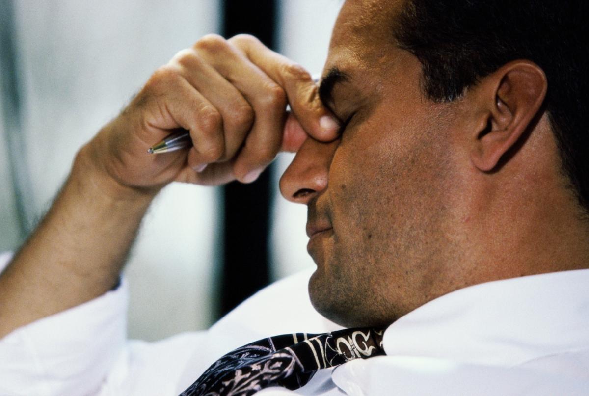 stressed businessman worried depressed overworked
