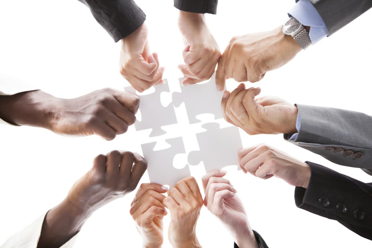 teamwork puzzle organized pieces together