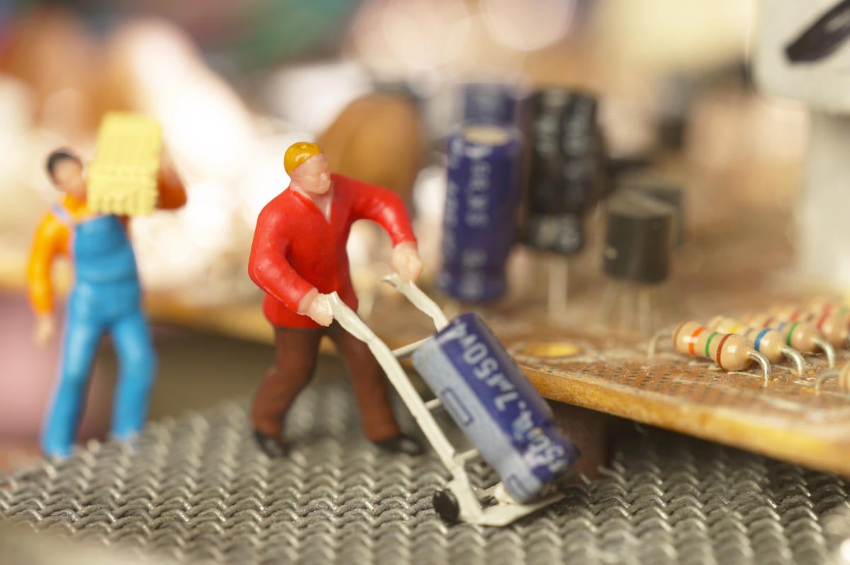 microservices - minitature figurines service a circuit board