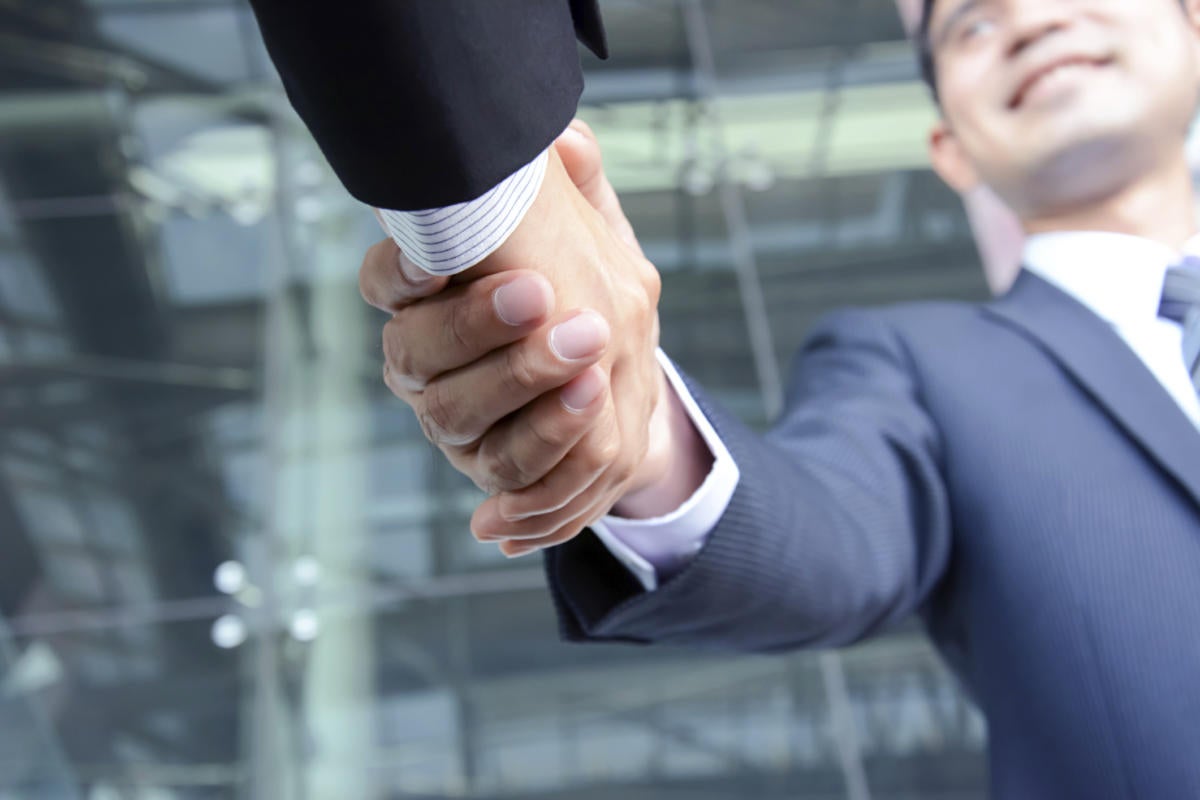 two businessmen shaking hands