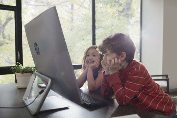 children watching a movie on the hp pavilion all in one