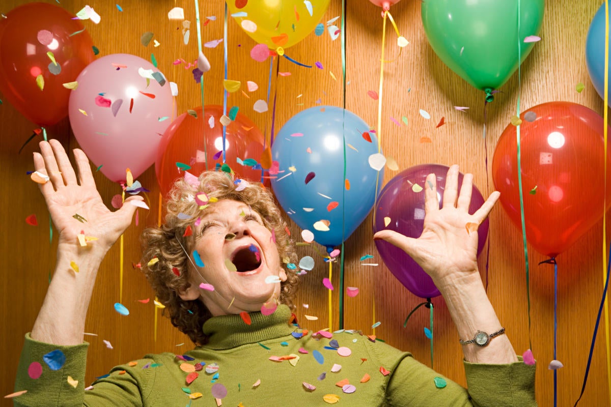 Woman surprised with balloons