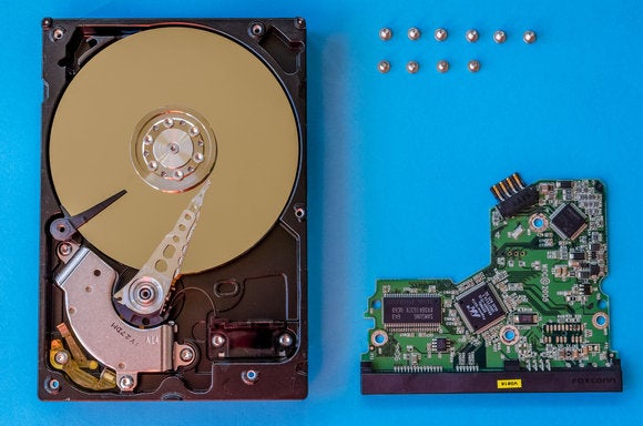 We tear apart a hard drive and SSD to show you how they work | PCWorld