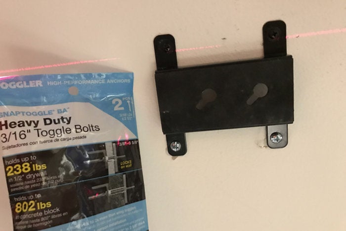 I bolted the four-way bracket to a ceiling stud for the first two screws and then used heavy duty to