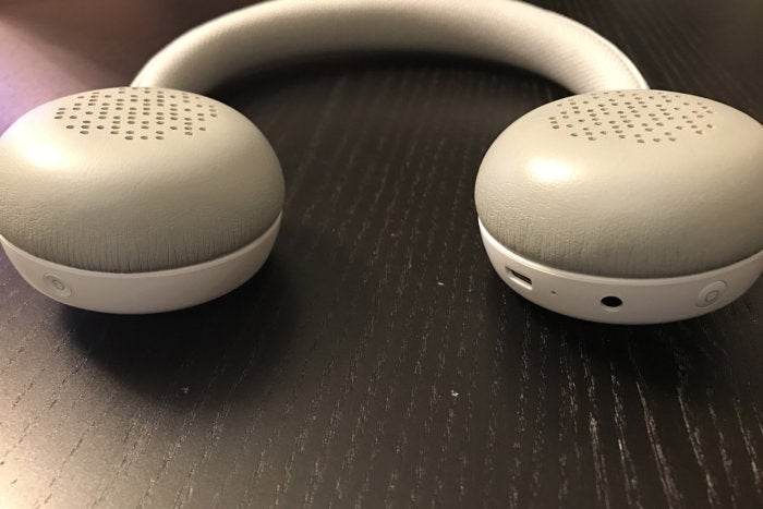The bottom of the left ear cup sports the power button while the right ear cup has a micro USB charg