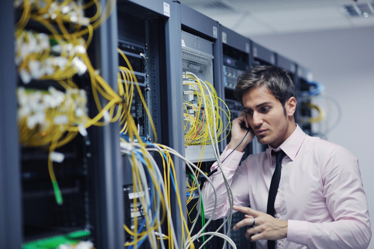 Tech support in network room on helpdesk