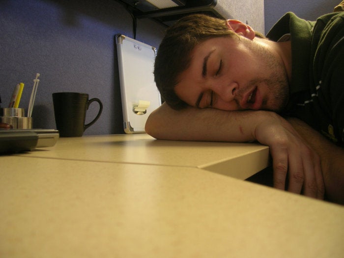 man asleep at desk