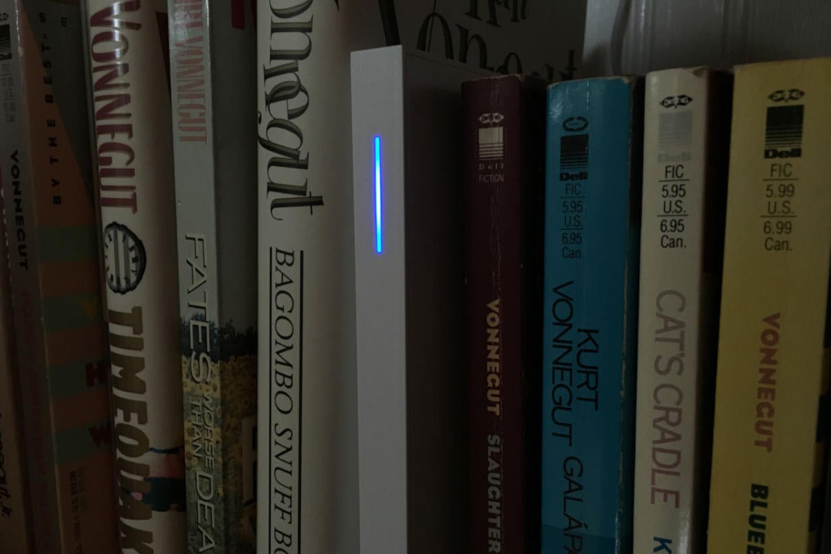 Wink Hub 2 on a bookshelf