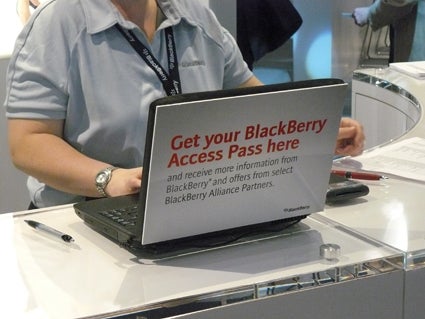 RIM representative distributing BlackBerry Access Passes at CTIA