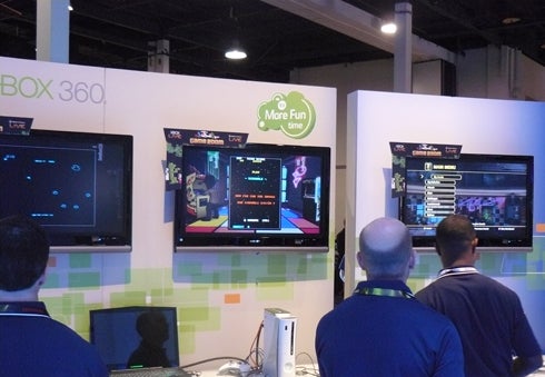 Microsoft representatives play video games on Xbox 360 machines and Windows PCs along   with CES attendees