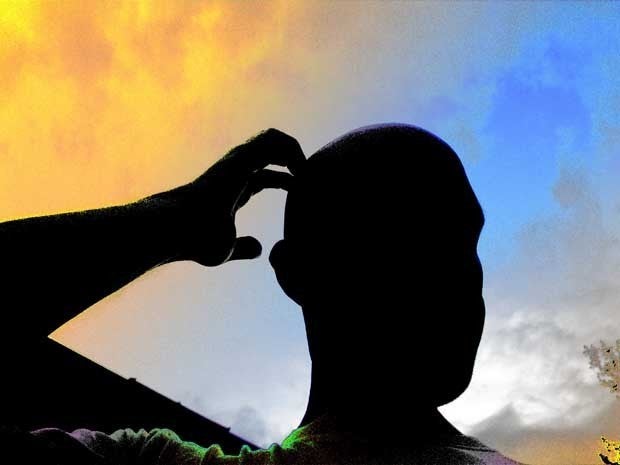 Picture of man scratching his head